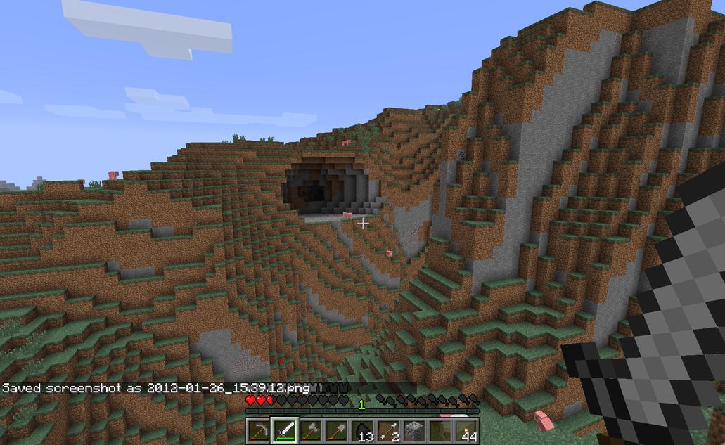 A cave, as seen from the top of the outcropping in the next picture, also west of my new shelter.