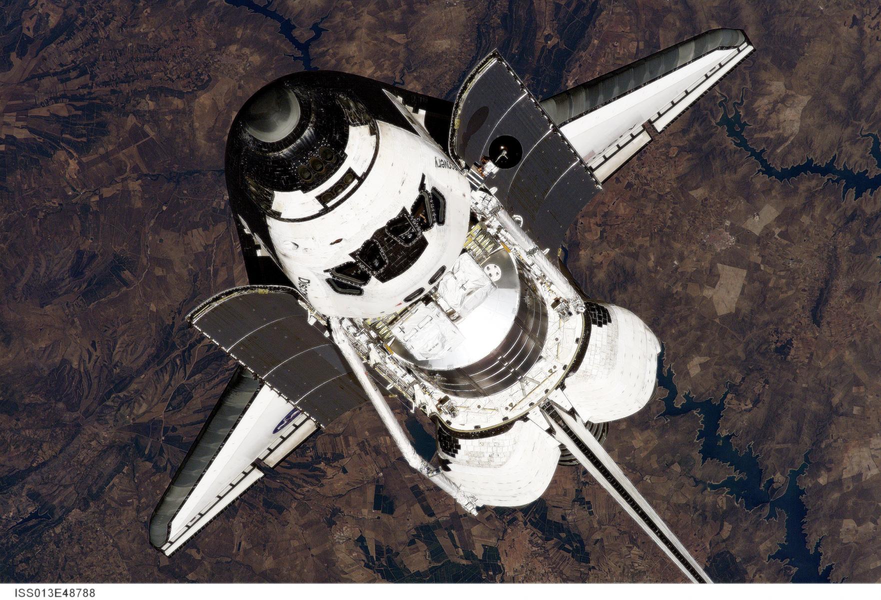 Discovery through the ISS. (edited)