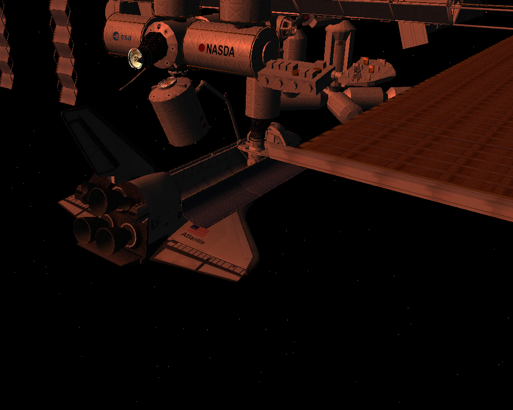 The ISS glowing in beautyful red at sunset